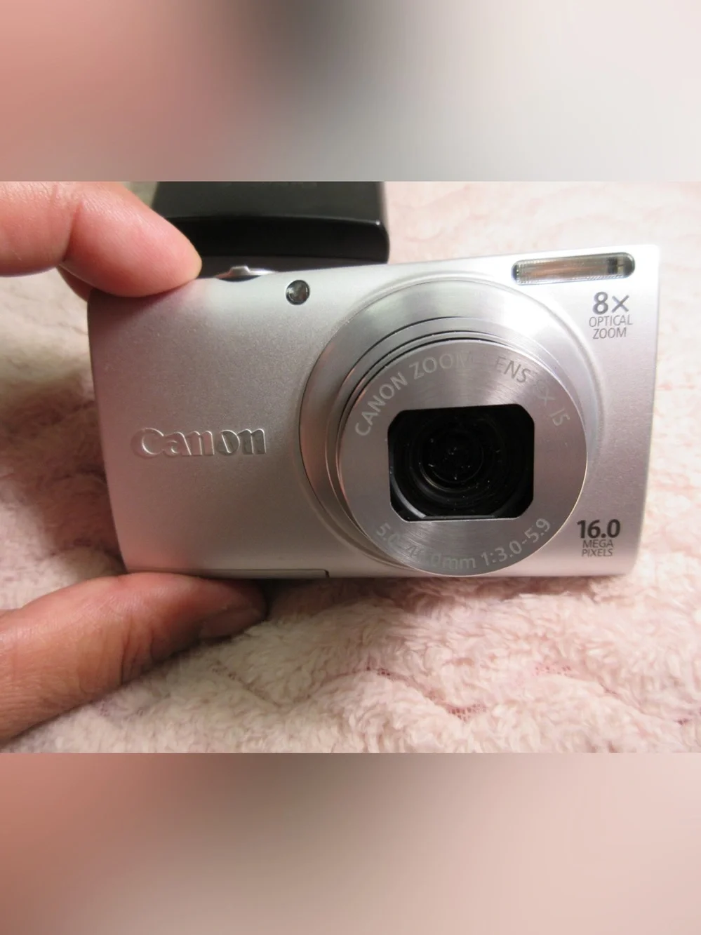 Canon Silver Compact Camera with Black Charger and Accessories
